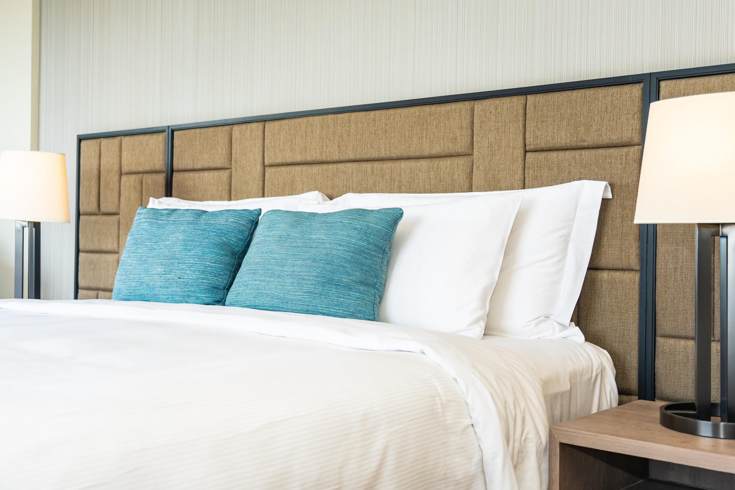 White comfortable pillow on bed decoration interior